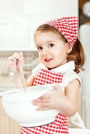 beautiful little girl baking